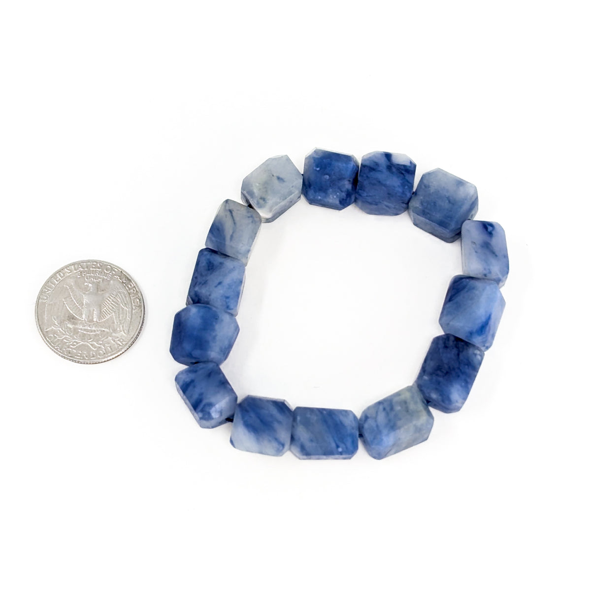 Afghanite bead bracelet: bracelet beside a coin