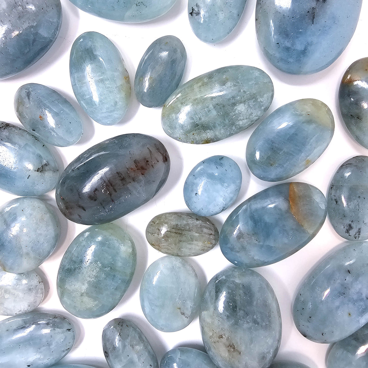 Aquamarine palm stone, a variety of beryl, from Pakistan.