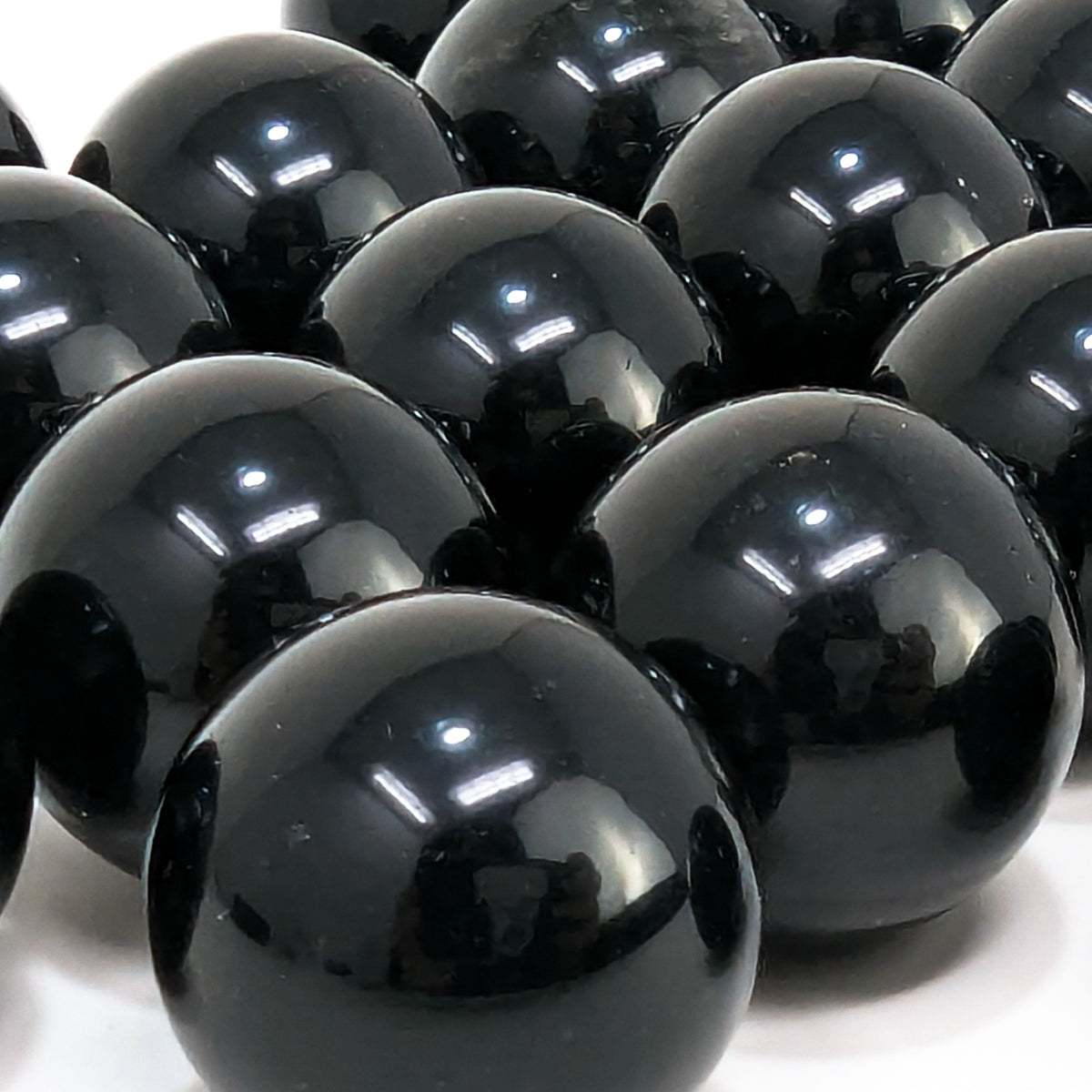 Black obsidian mini sphere from Mexico – pile of spheres