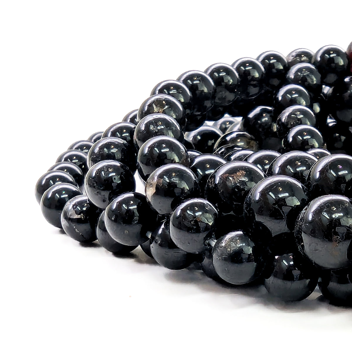 Black tourmaline bead bracelet: close view of polished beads