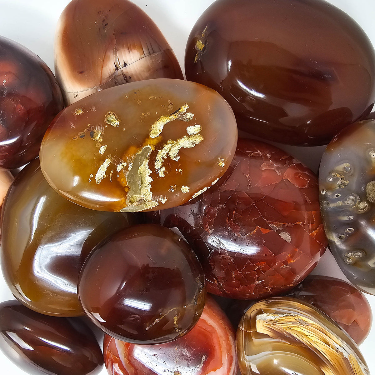Carnelian palmstone, a variety of chalcedony, from Madagascar.