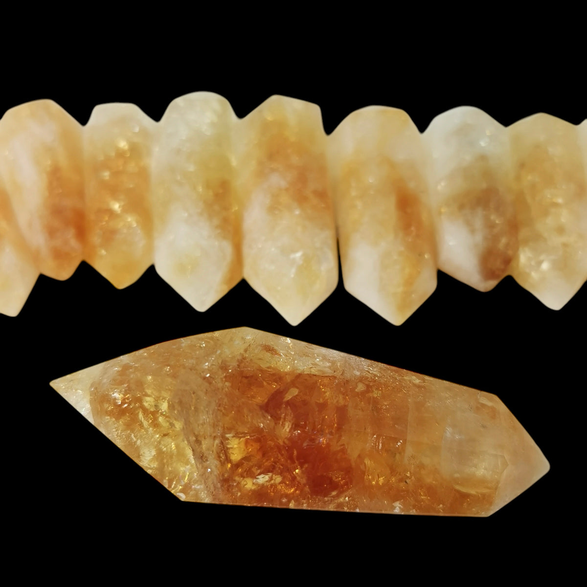 Citrine Vogel wand, Brazil: row of wands above a large one