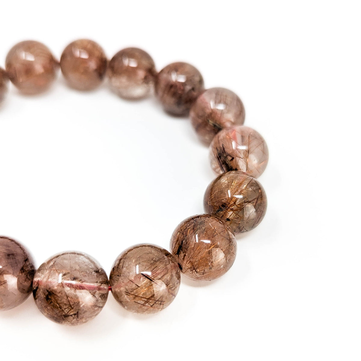 Copper rutile in quartz bead bracelet from Brazil – close-up of one bracelet