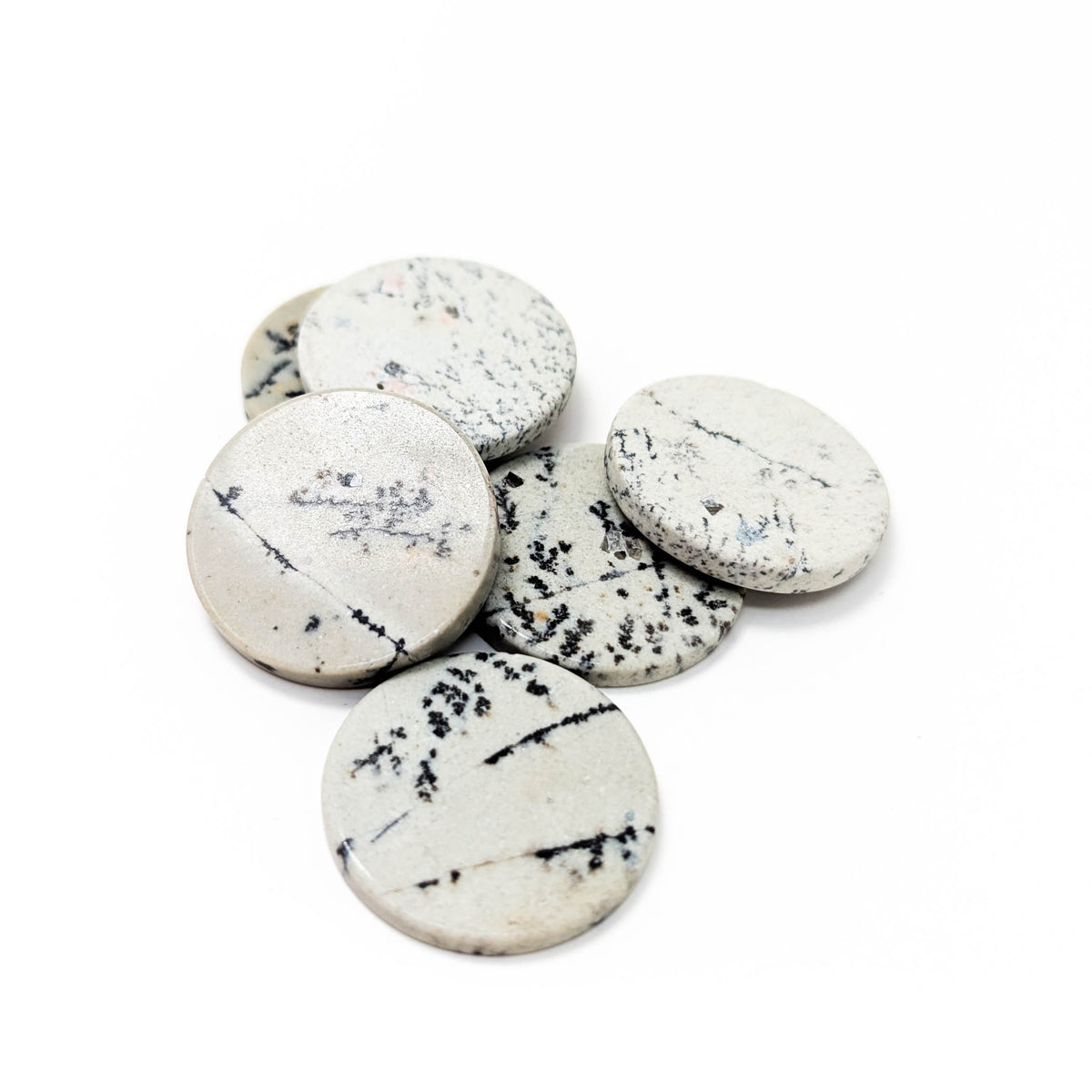 Dendritic Agate flat disk, a variety of chalcedony.