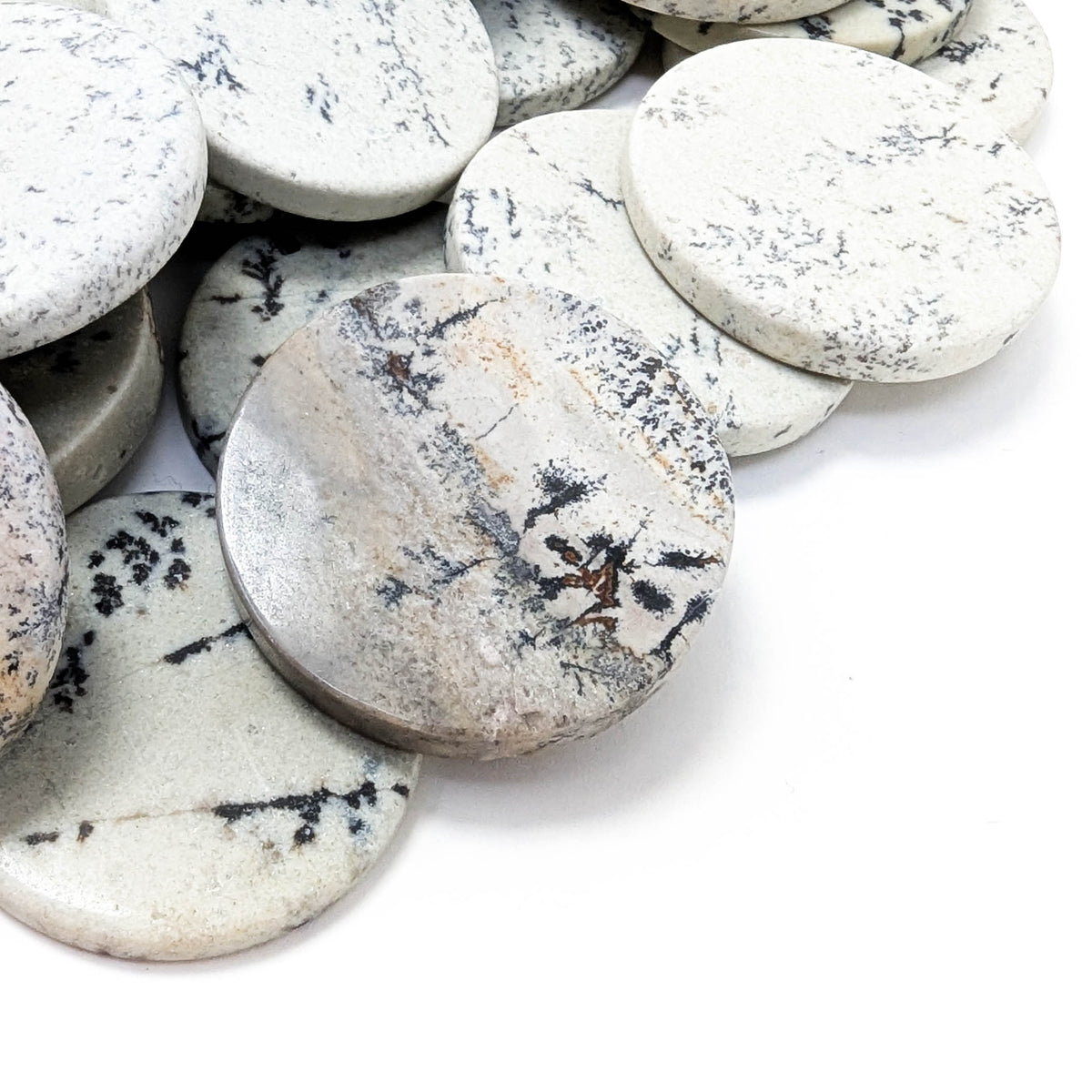 Dendritic Agate flat disk, a variety of chalcedony.
