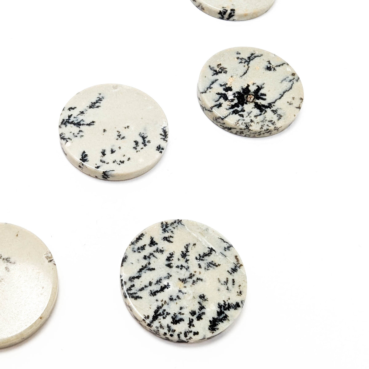Dendritic Agate flat disk, a variety of chalcedony.