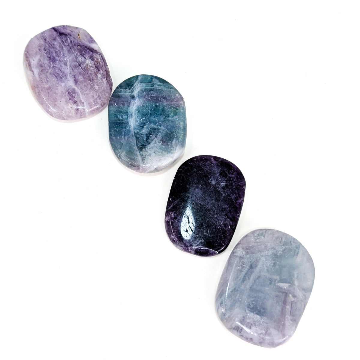 Large fluorite flat tumble from China – row of four stones