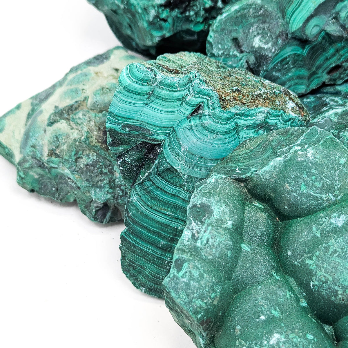 Malachite rough, a copper carbonate.