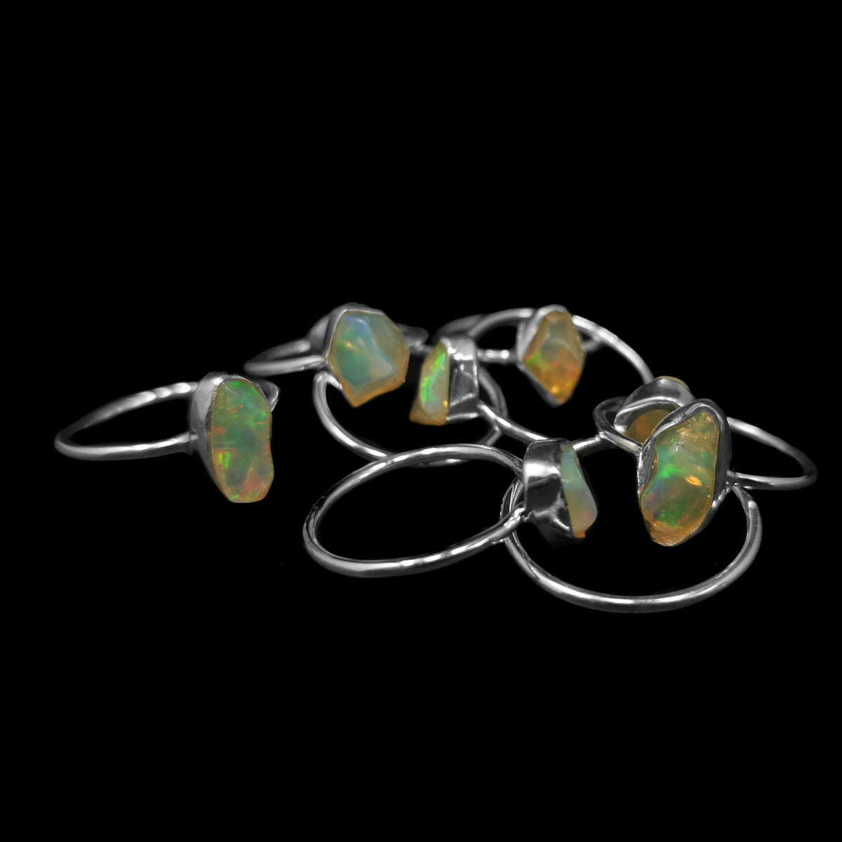 Ethiopian opal freeform ring: pile of rings