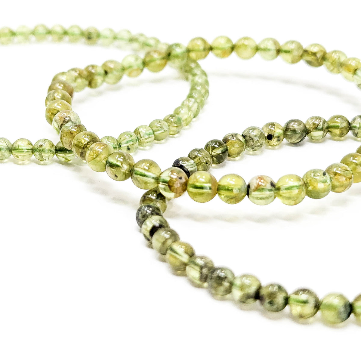 Peridot bead bracelet – two bracelets overlapping