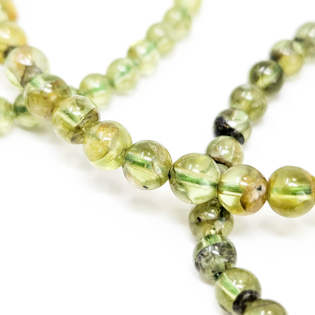 Peridot bead bracelet – close-up of loose beads