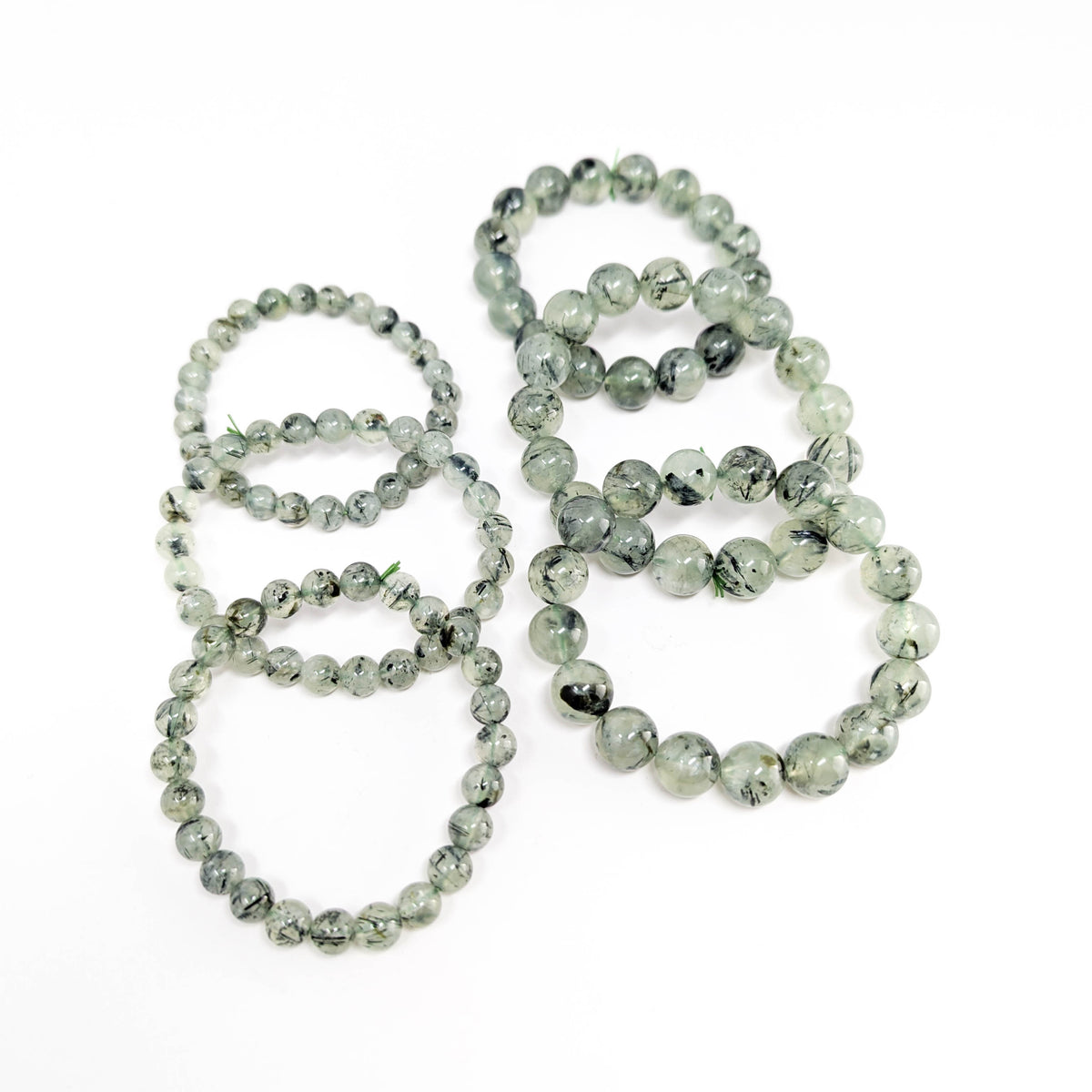Prehnite with tourmaline bracelet: bracelet flat lay