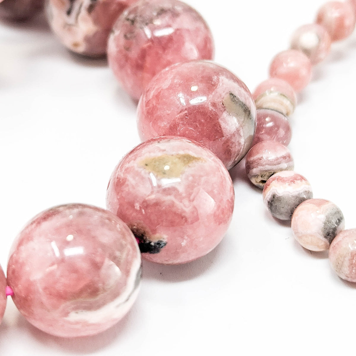 Rhodochrosite round bead bracelet – large beads, close up