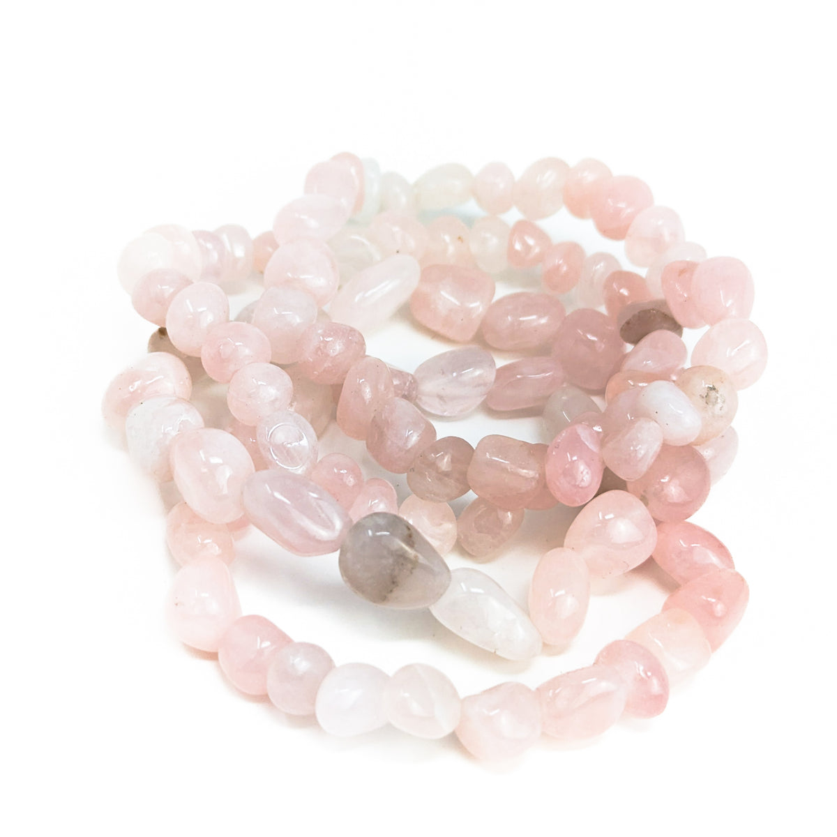 Rose quartz tumbled bead bracelet – pile of bracelets, close view