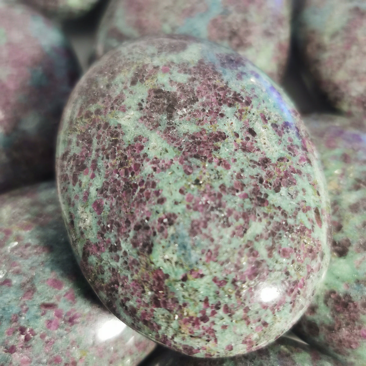 Ruby in kyanite palm stone, India: close view of one palm stone