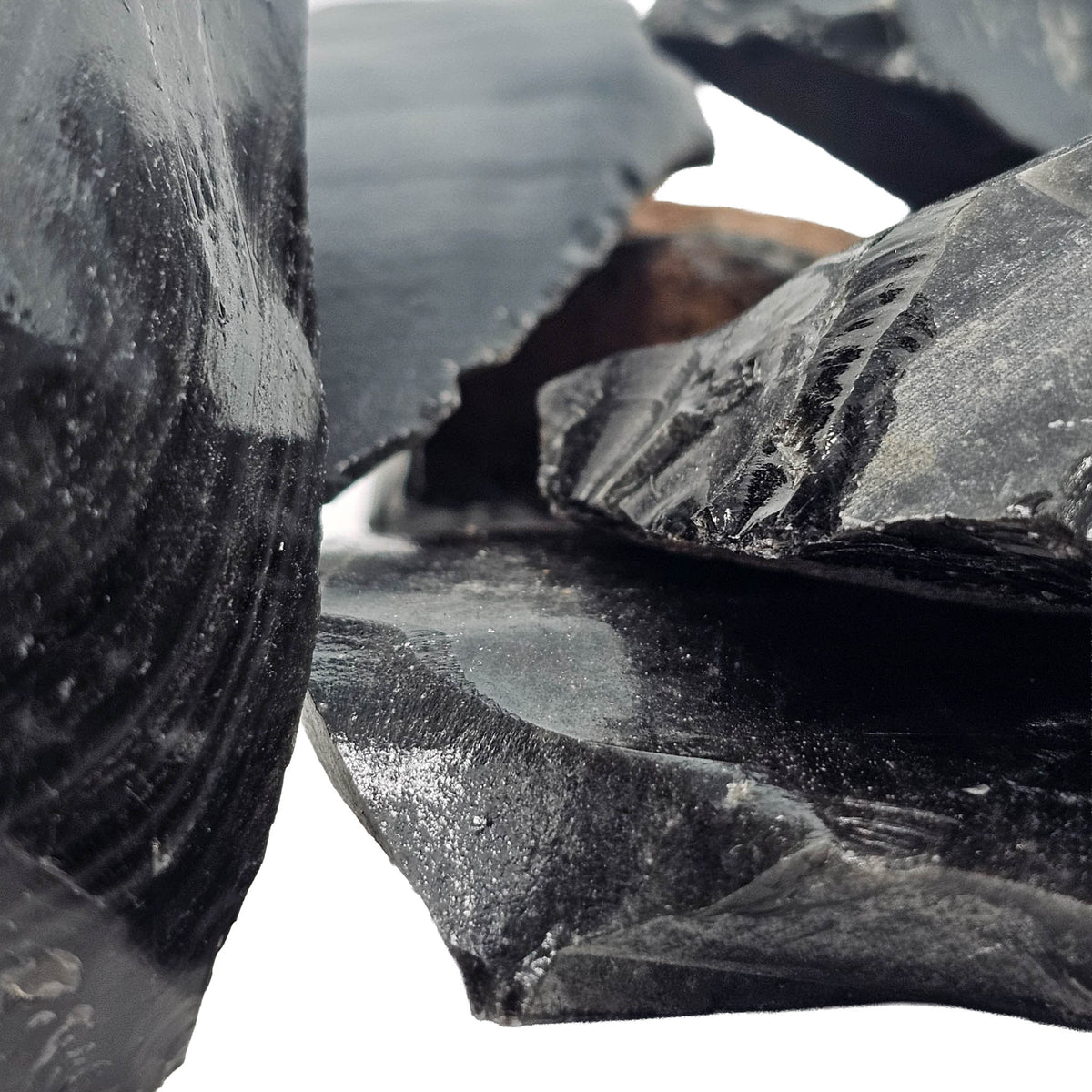 Silver sheen obsidian rough from Mexico – close-up of glassy pieces