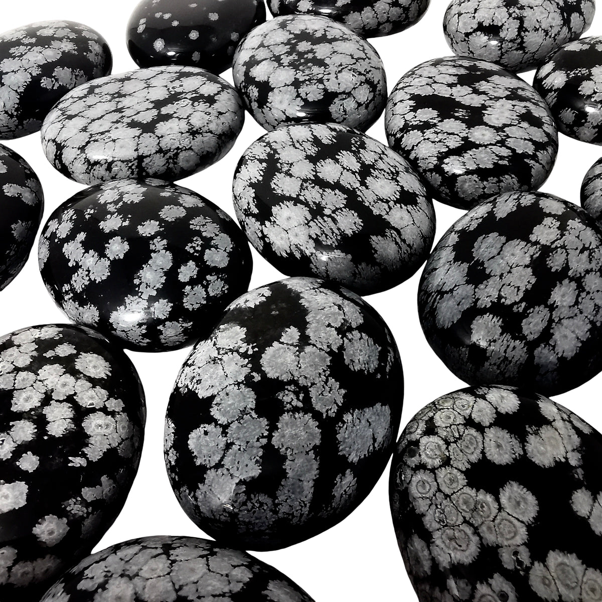 Snowflake obsidian palm stone from Utah – close-up of many stones