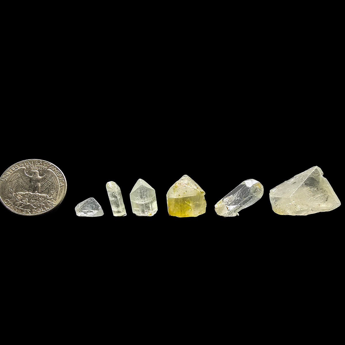 Topaz crystal from Nigeria – size range beside a coin for scale