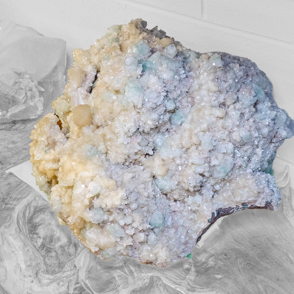 Stilbite with green apophyllite crystal cluster from Pune, India – close view of the crystal face with green apophyllite