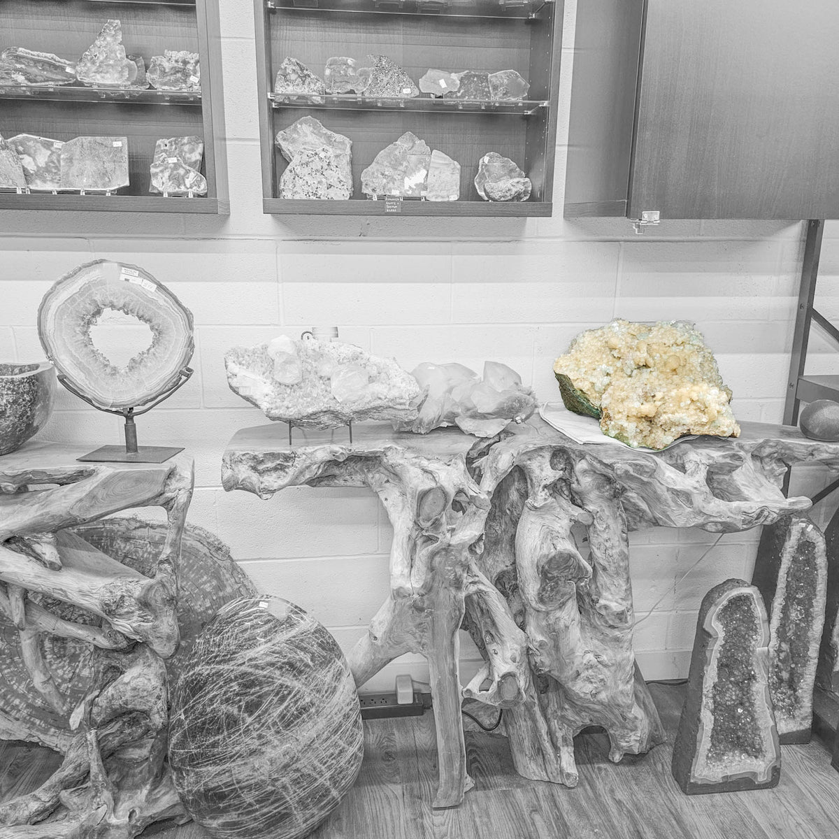 Stilbite with green apophyllite crystal cluster from Pune, India – displayed on a wooden stand in the shop