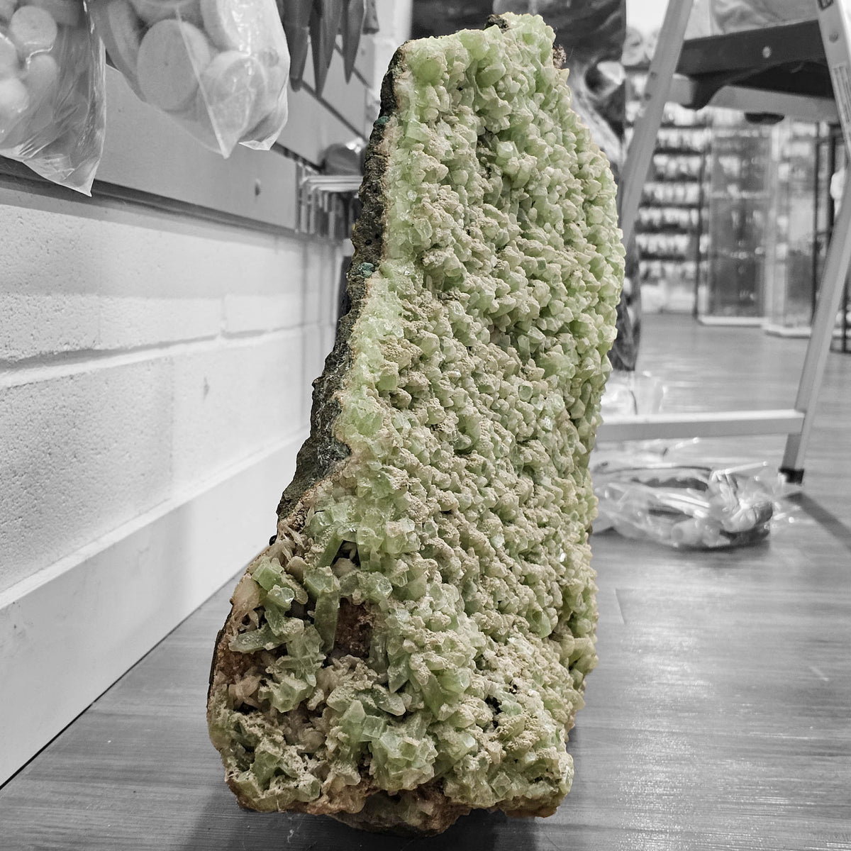 Green apophyllite crystal plate from Maharashtra, India – standing on edge showing the plate's thickness