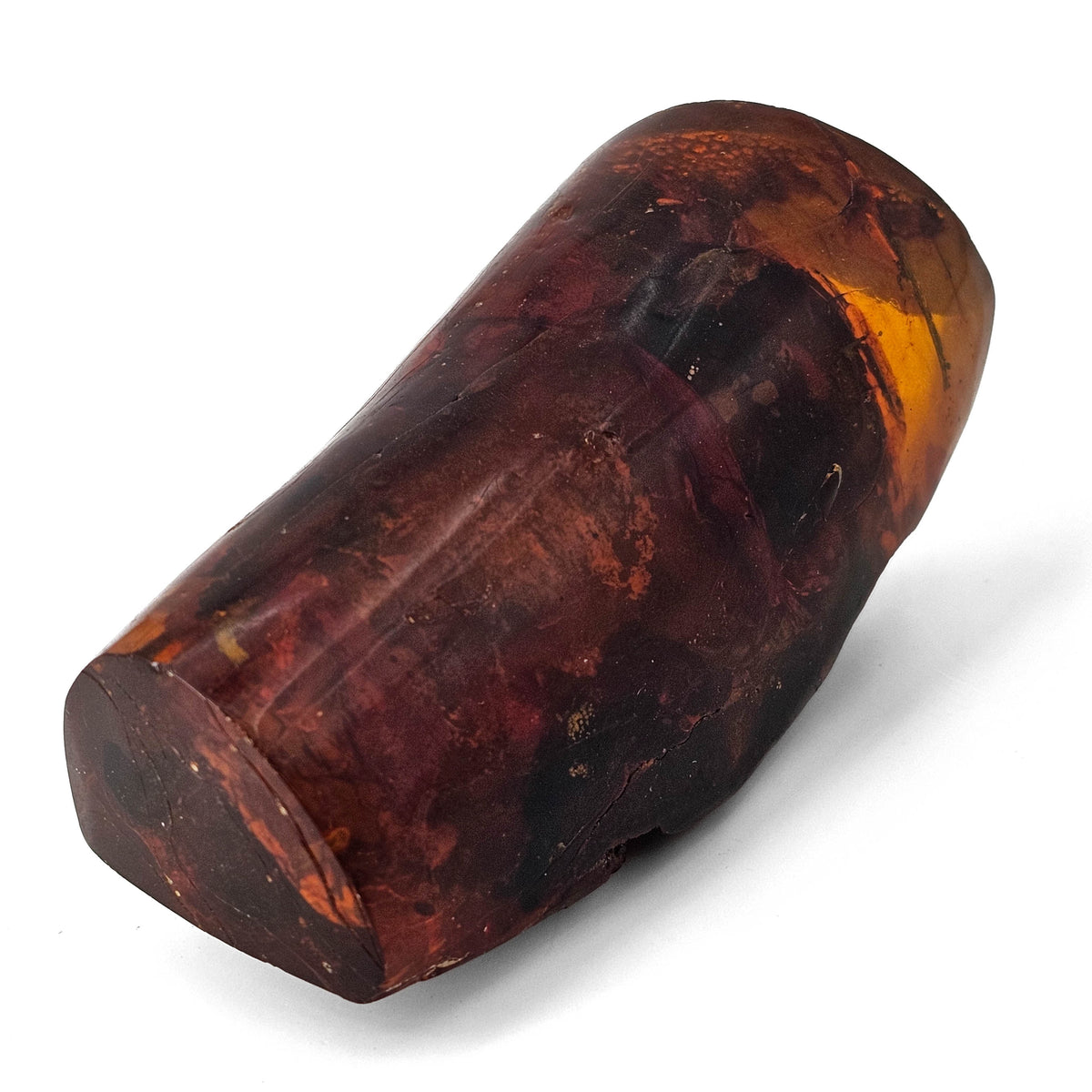 Polished Amber fossil specimen.
