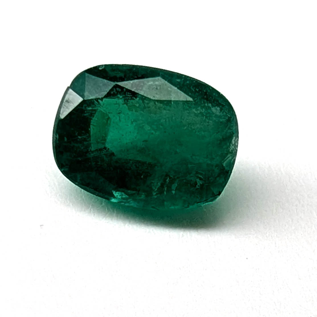 Emerald faceted cushion cut gemstone, 1.24ct, main view, view 1 of 11