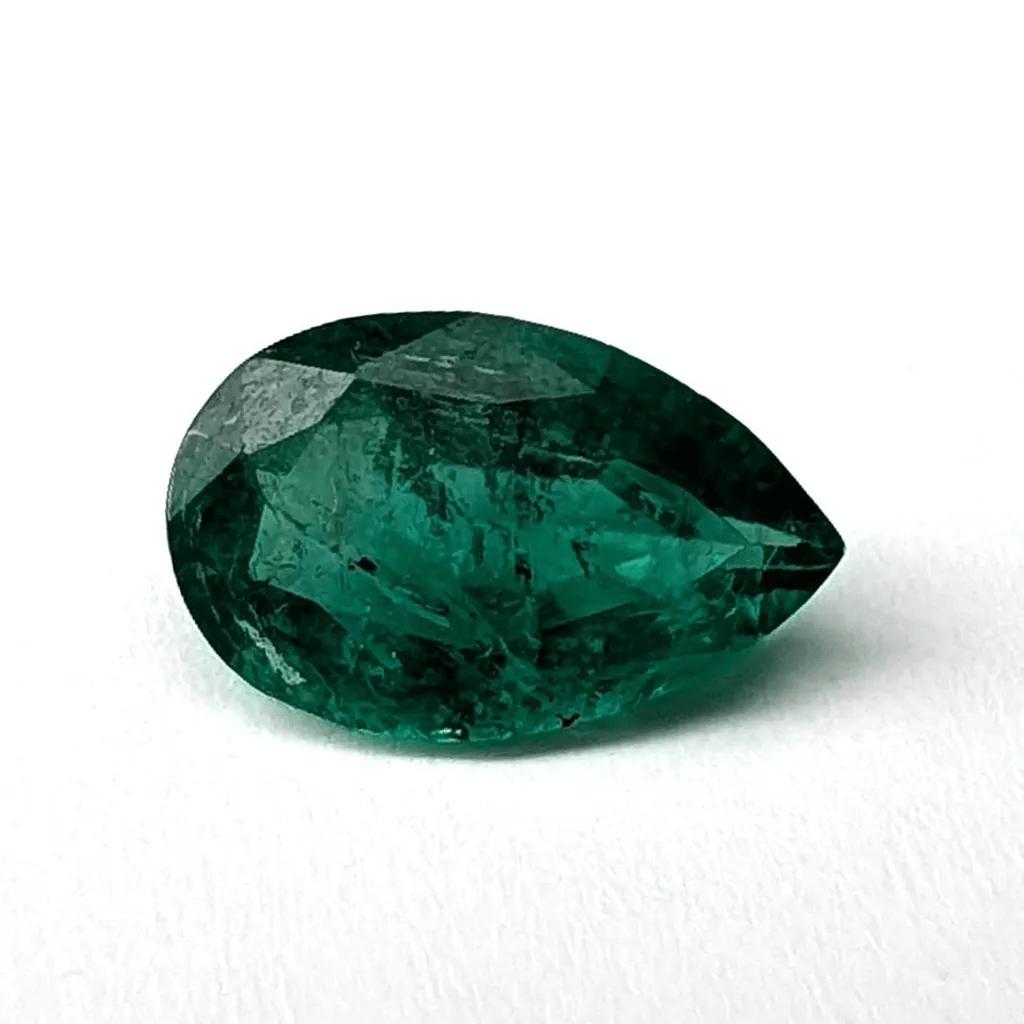 Emerald faceted pear cut gemstone, 0.94ct, rotating view