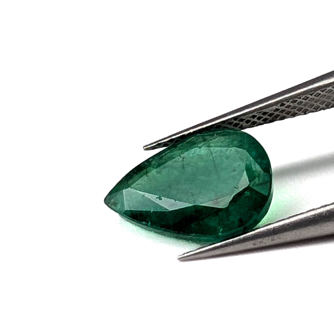 Emerald faceted pear cut gemstone, 2.80ct, held in tweezers, view 11 of 13