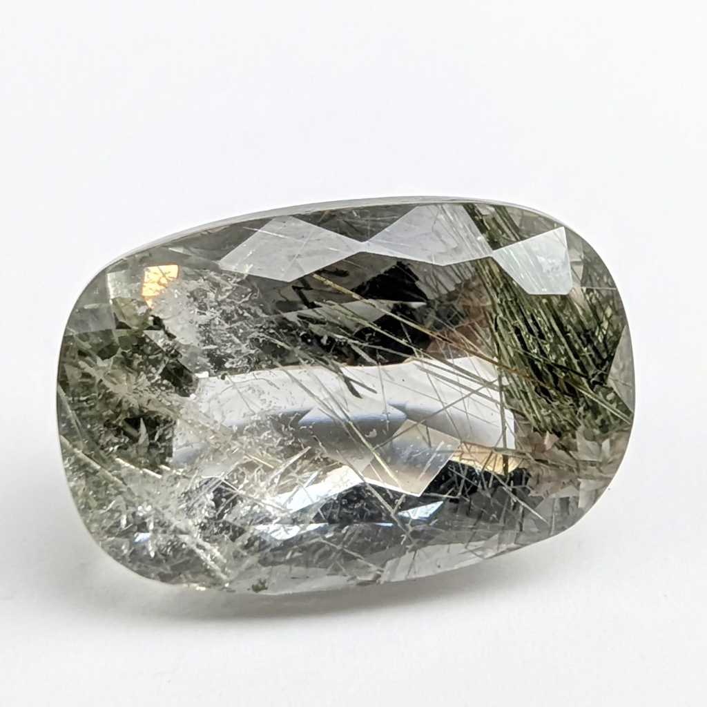 Actinolite quartz faceted cushion gemstone, 8.02ct, from Mount Breakenridge, Harrison Lake, BC, Canada, on a white background, view 1 of 11