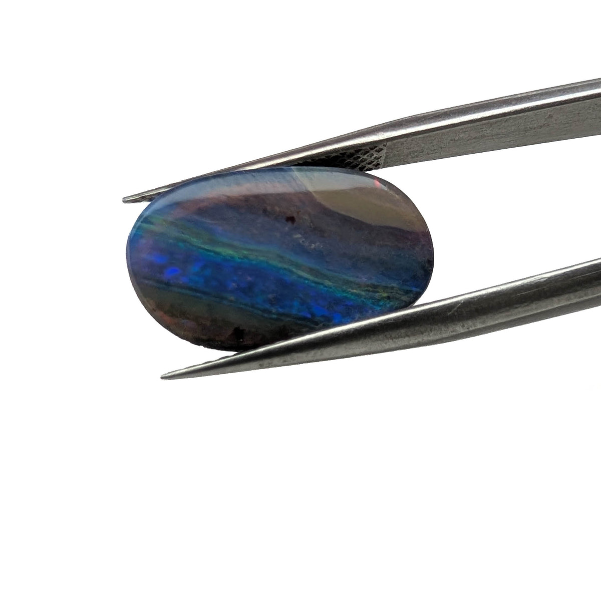 Solid Australian opal cabochon freeform gemstone, 5.06ct, from Queensland, Australia, held in tweezers, view 2 of 8