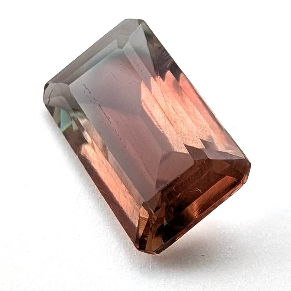 Oregon sunstone faceted emerald gemstone, 2.80ct, on a white background, view 1 of 11