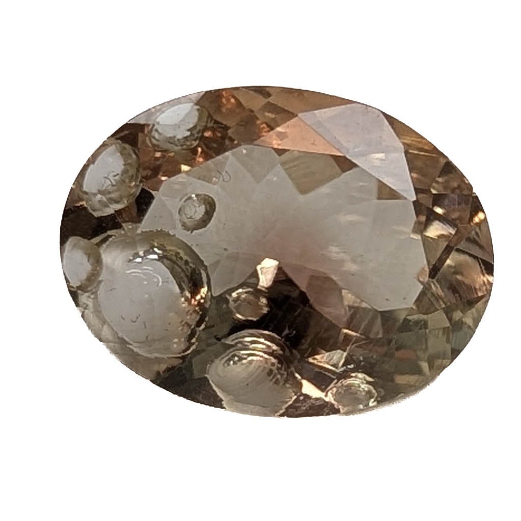 Oregon Sunstone faceted oval fantasy cut gemstone, 4.31ct, from Plush, Oregon, on a white background, view 1 of 10