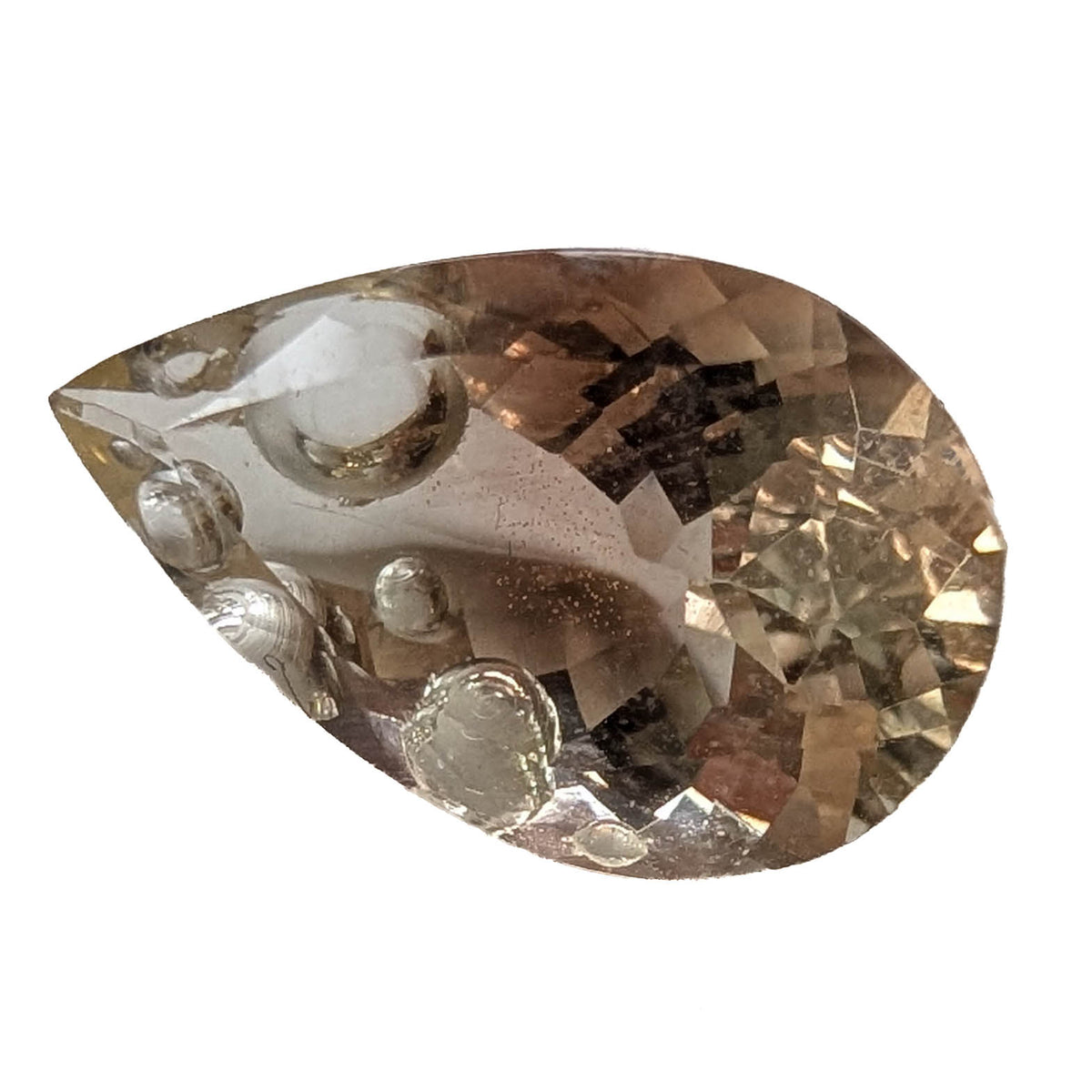 Oregon Sunstone faceted pear fantasy cut gemstone, 3.76ct, from Plush, Oregon, on a white background, view 1 of 11
