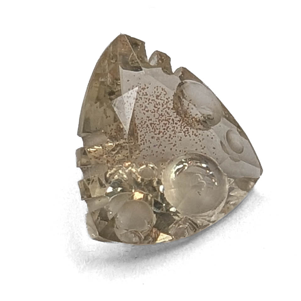 Oregon Sunstone faceted trillion fantasy cut gemstone, 2.50ct, from Plush, Oregon, on a white background, view 1 of 10