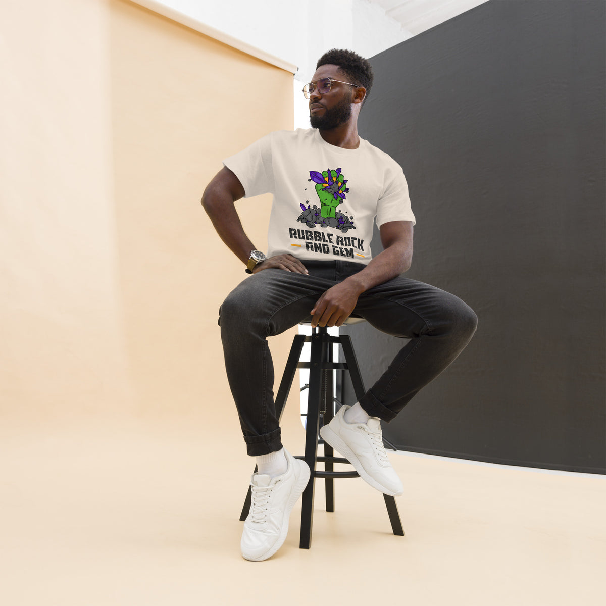 Rubble Rock and Gem classic logo tee – worn by man on stool