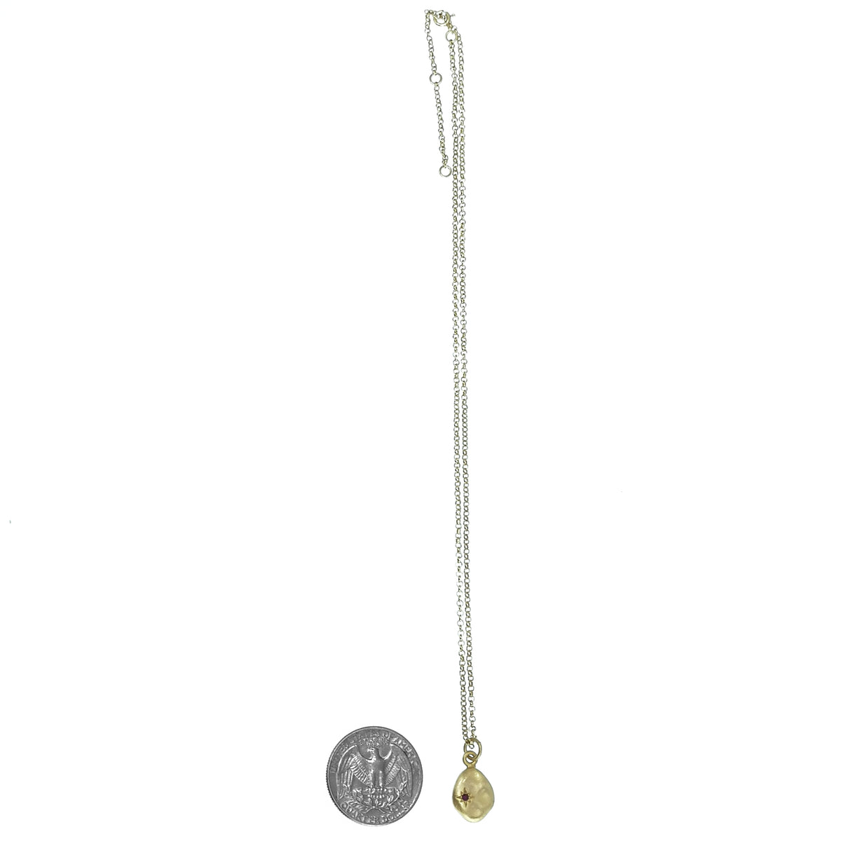 10kt gold plated nugget pendant: chain beside a coin