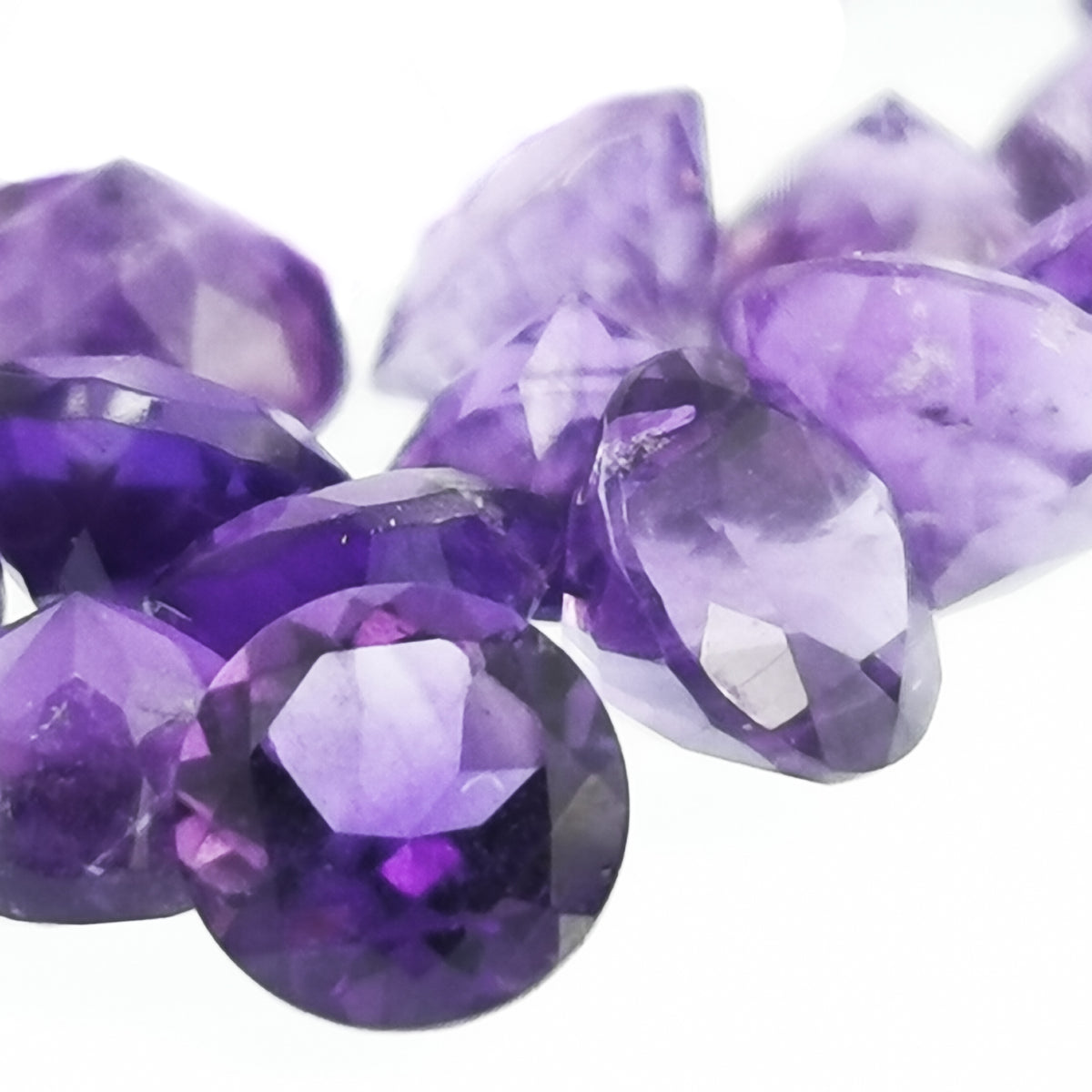 Faceted amethyst rounds, Brazil: close view of large facets