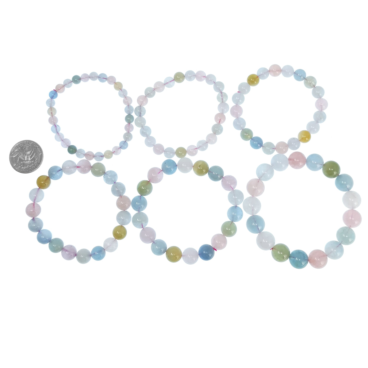 Beryl bead bracelet: six bracelets beside a coin