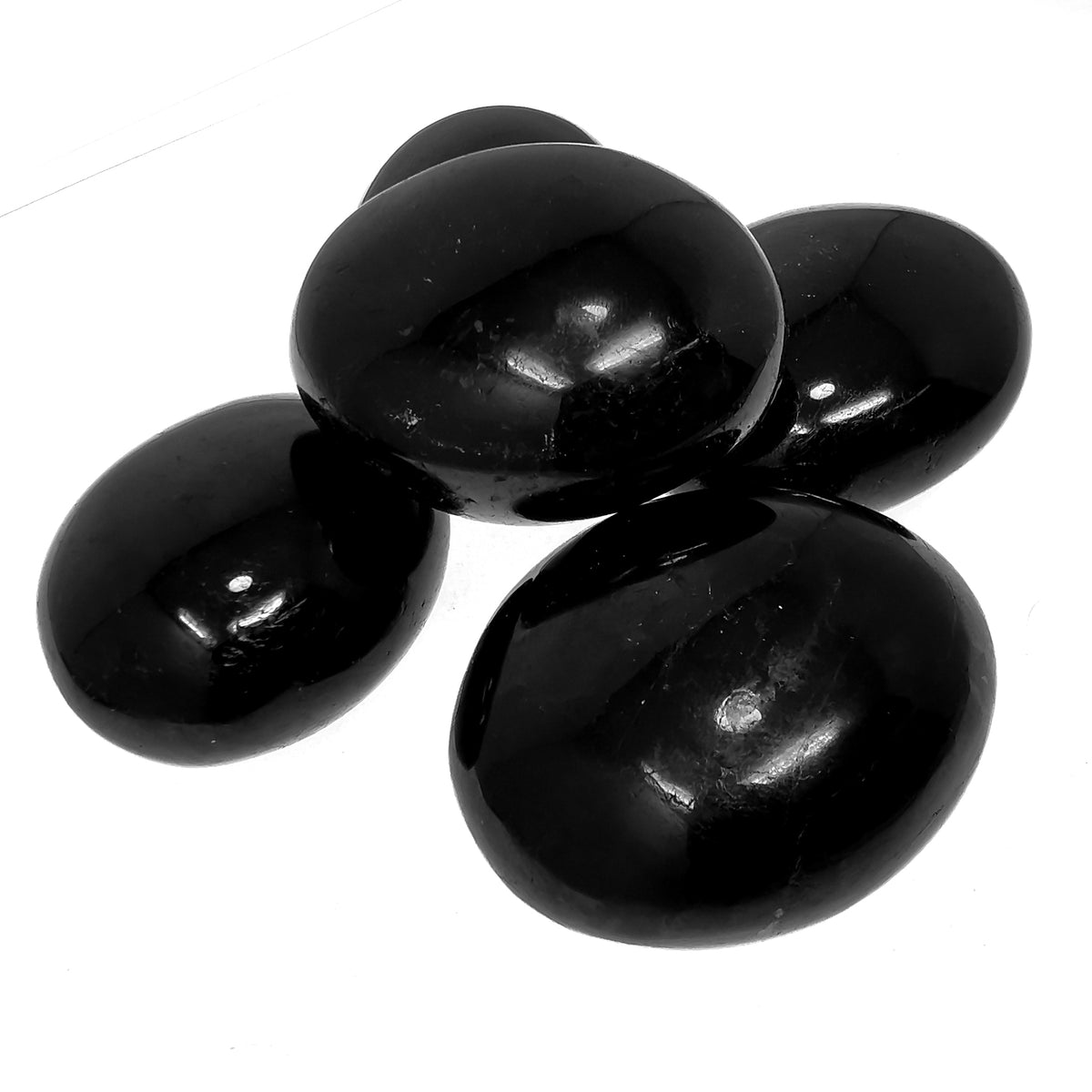 Black Tourmaline palm stone, a tourmaline group mineral, from Madagascar.