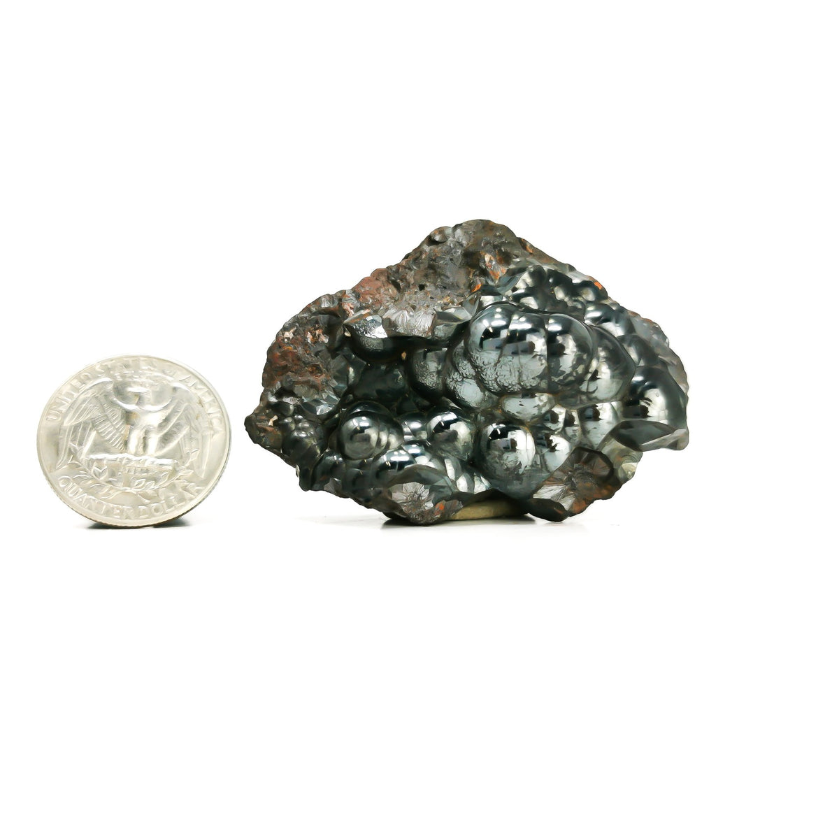 Botryoidal hematite from Irhoud Mine, Morocco – piece beside a coin for scale