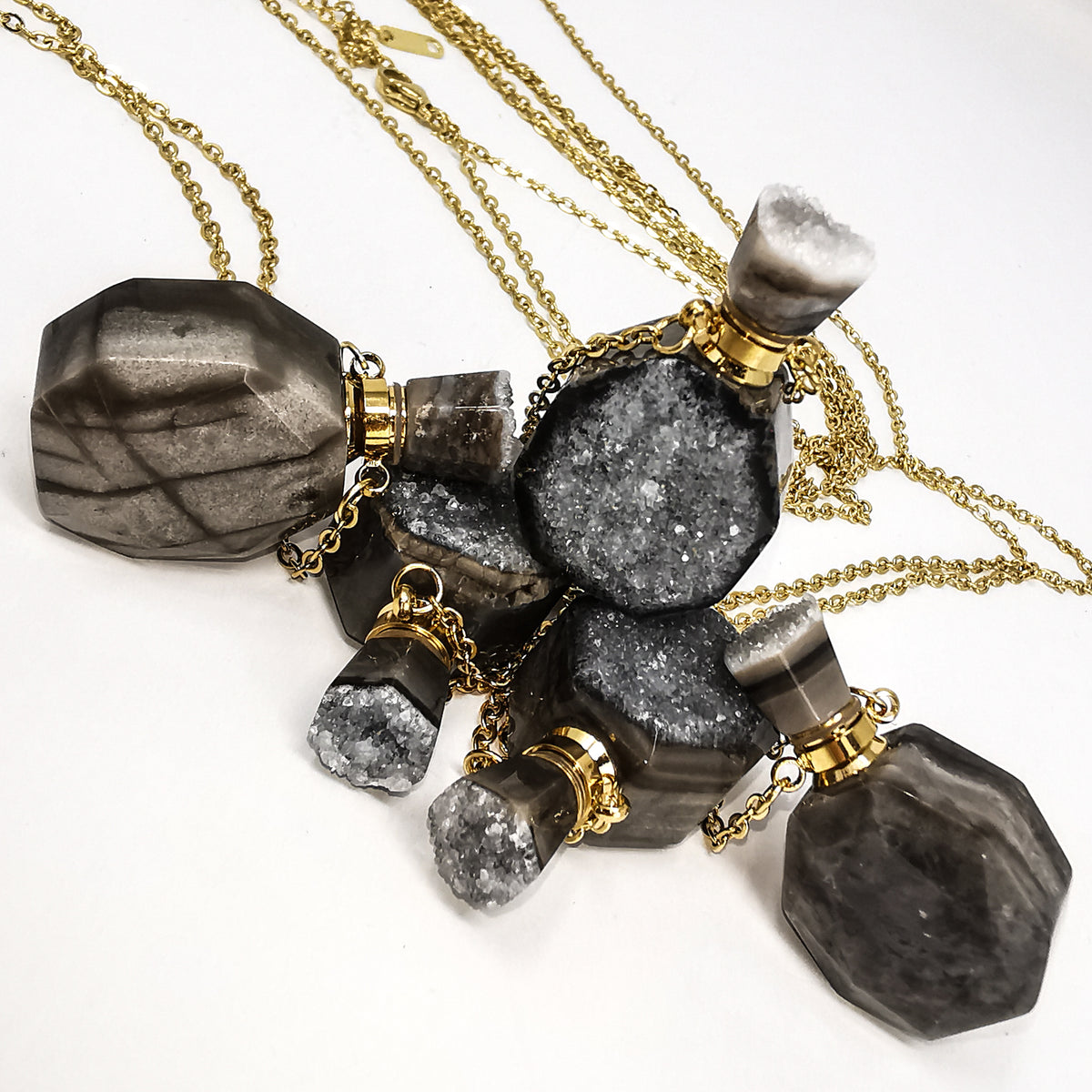 Quartz Druzy perfume bottle pendant in gold- or silver-plated base metal.