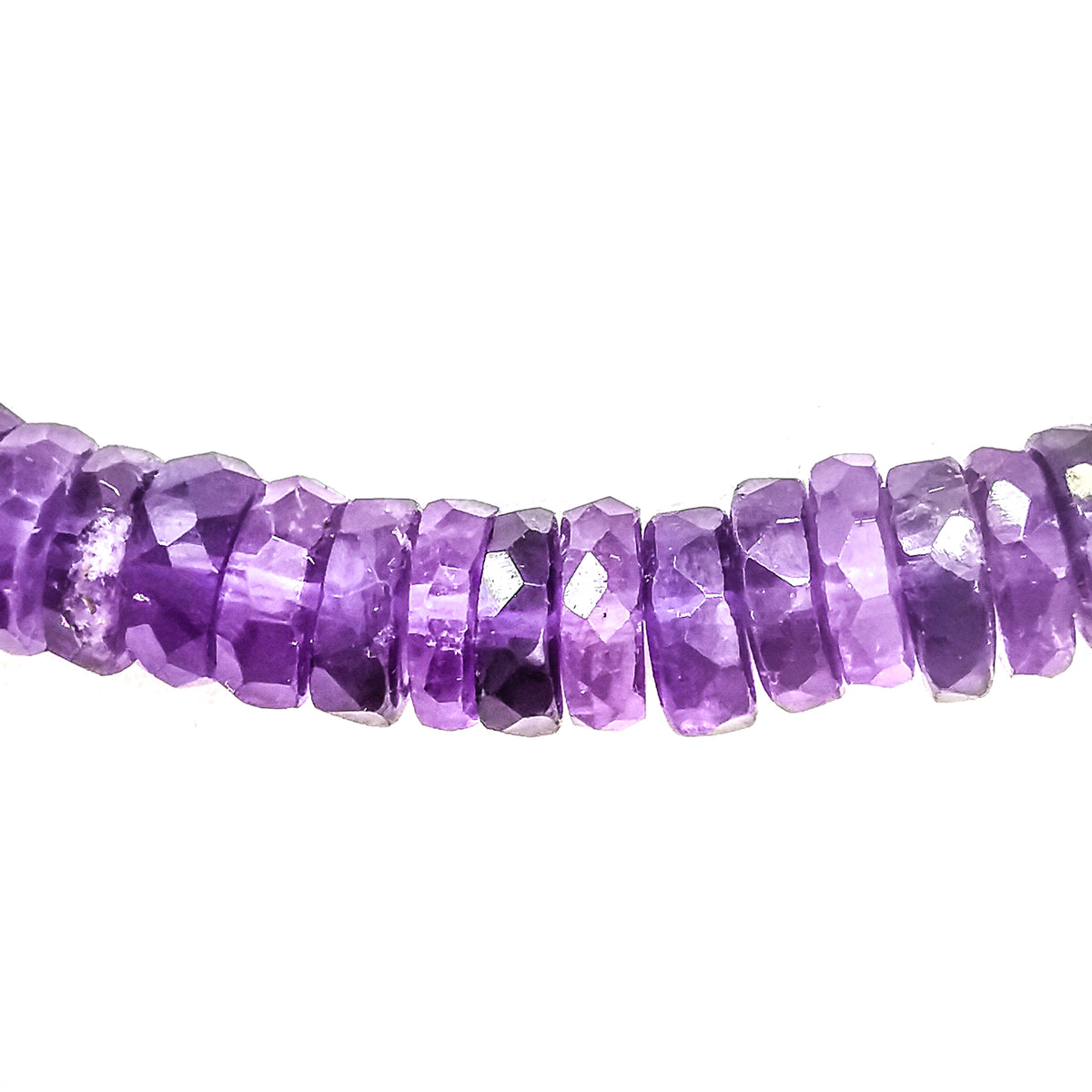 Wheel Shape facet bead necklace in sterling silver and steel wire.