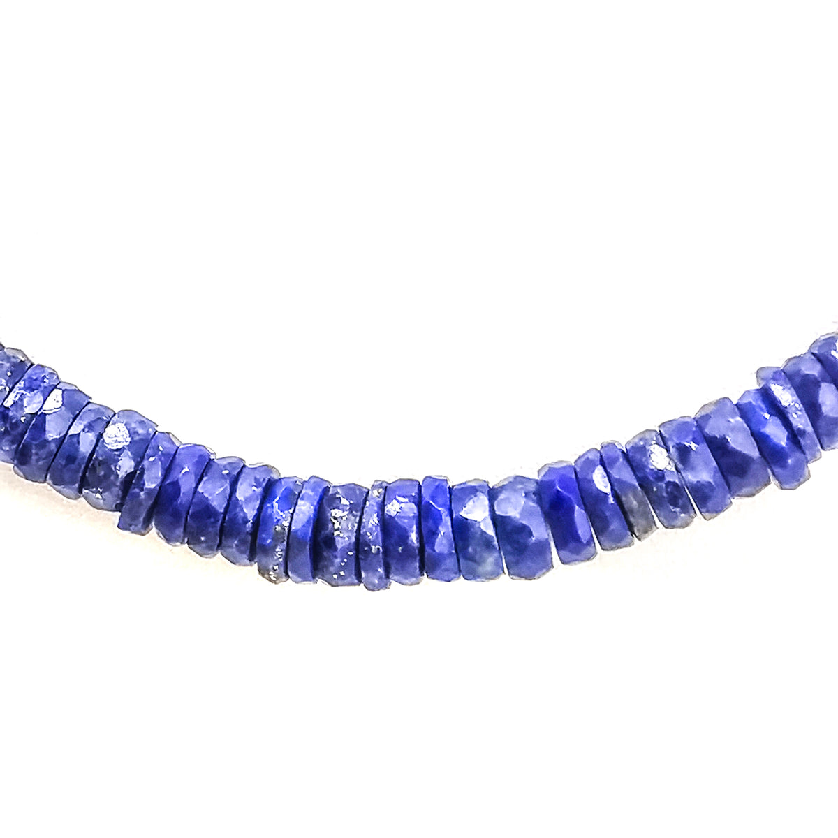 Wheel Shape facet bead necklace in sterling silver and steel wire.