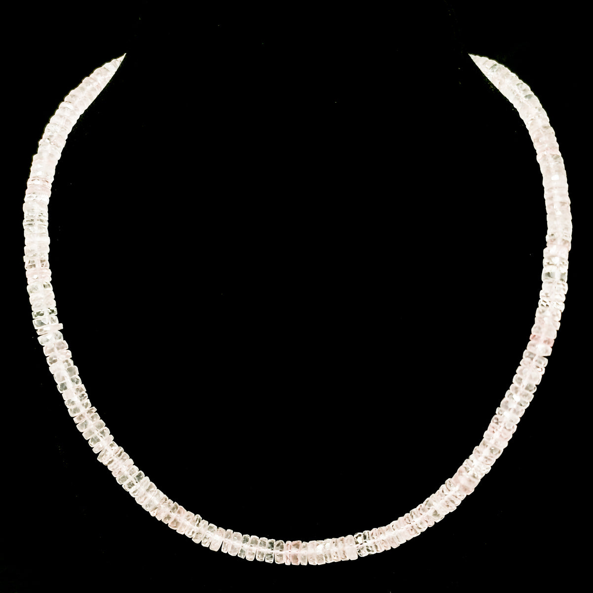 Wheel Shape facet bead necklace in sterling silver and steel wire.