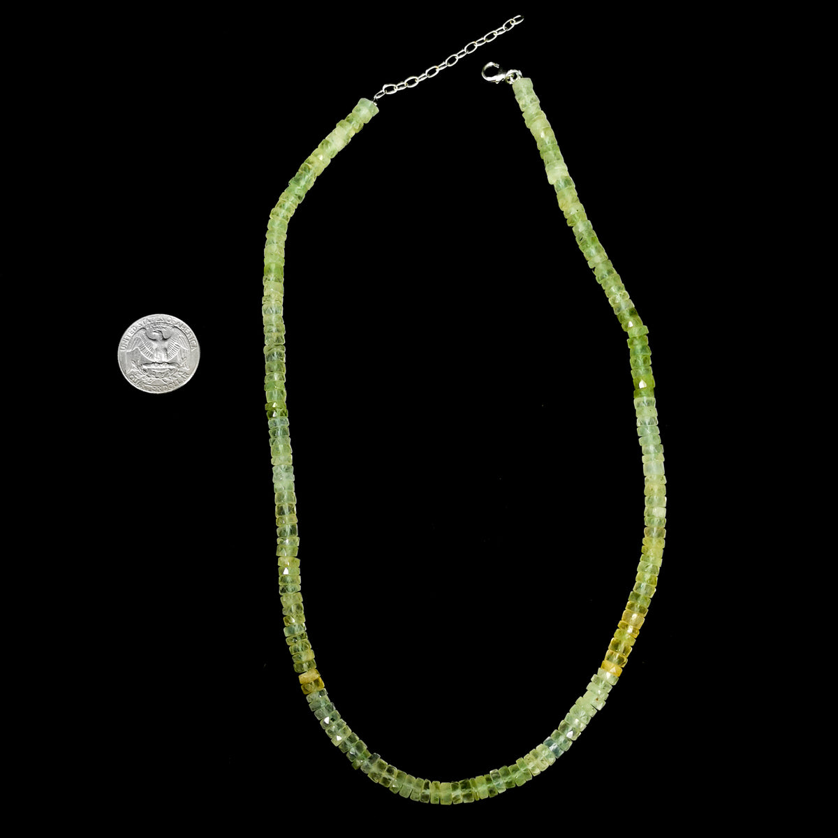 Wheel Shape facet bead necklace in sterling silver and steel wire.