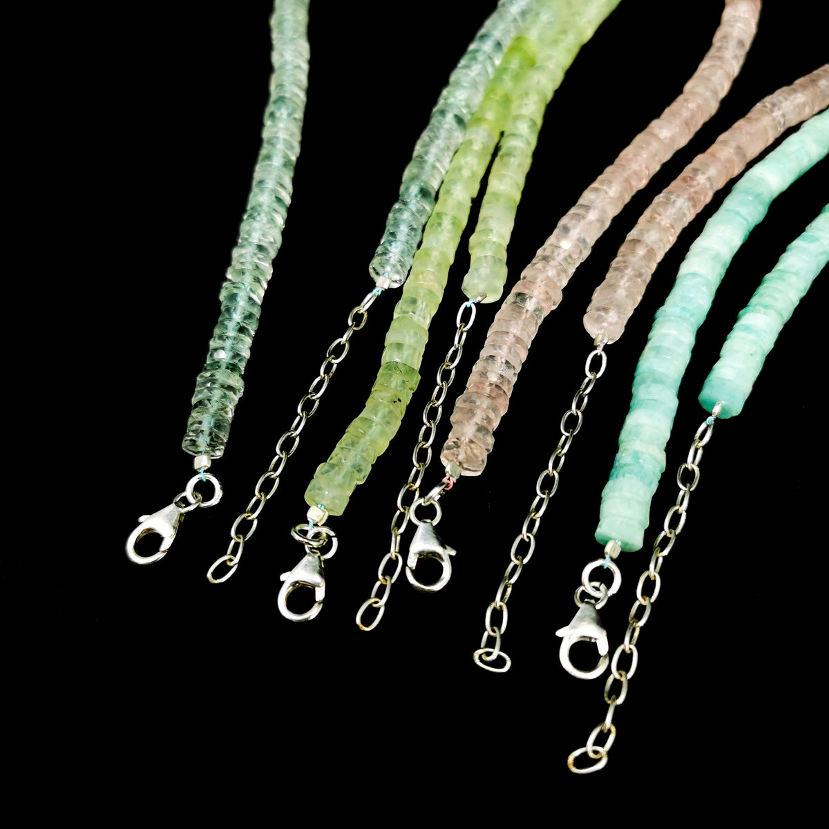 Wheel Shape facet bead necklace in sterling silver and steel wire.