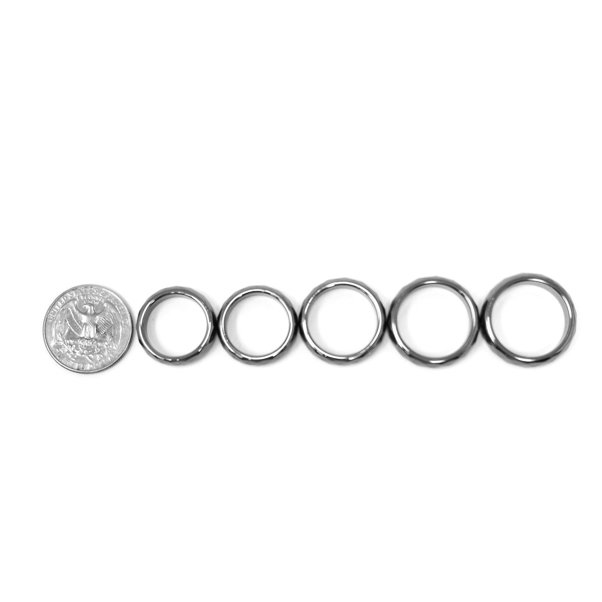 Faceted hematite stone ring – ring sizes beside a coin