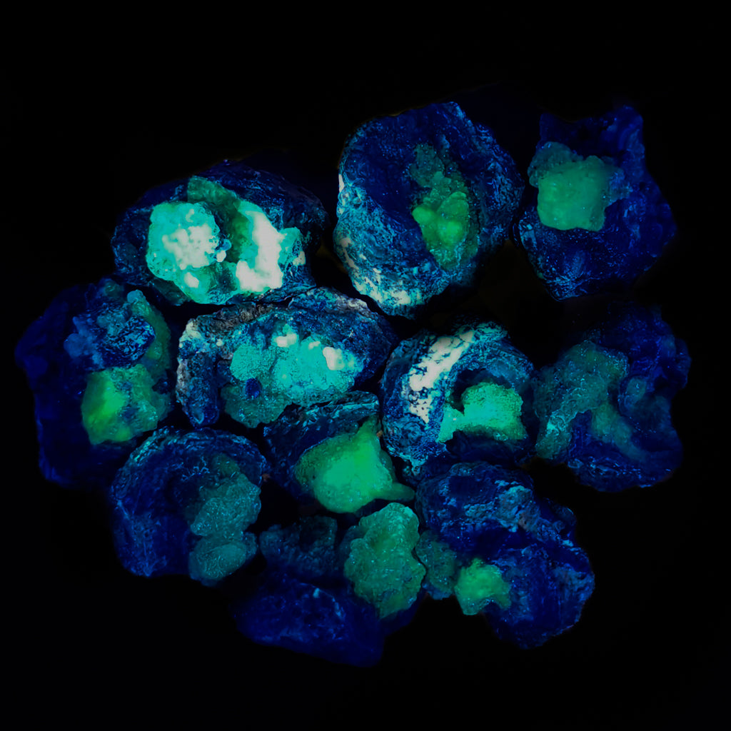 Hyalite opal, Hungary: specimens glowing under UV light