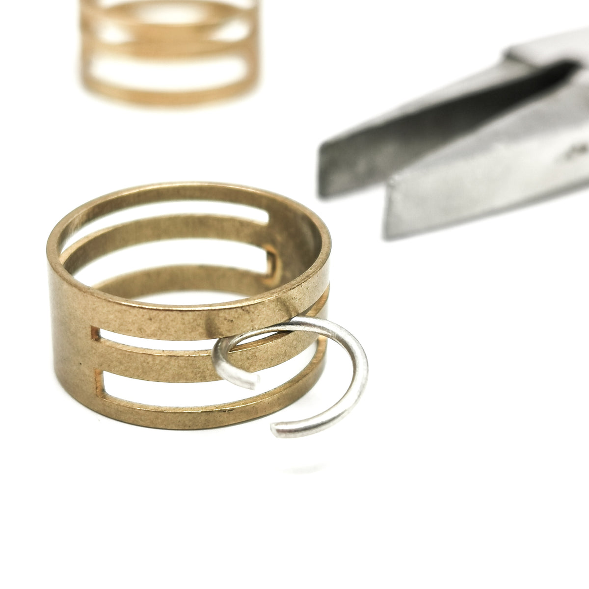 Jump Ring Closer smithing, made of brass.